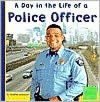 A Day in the Life of a Police Officer (First Facts Community Helpers at Work Series)